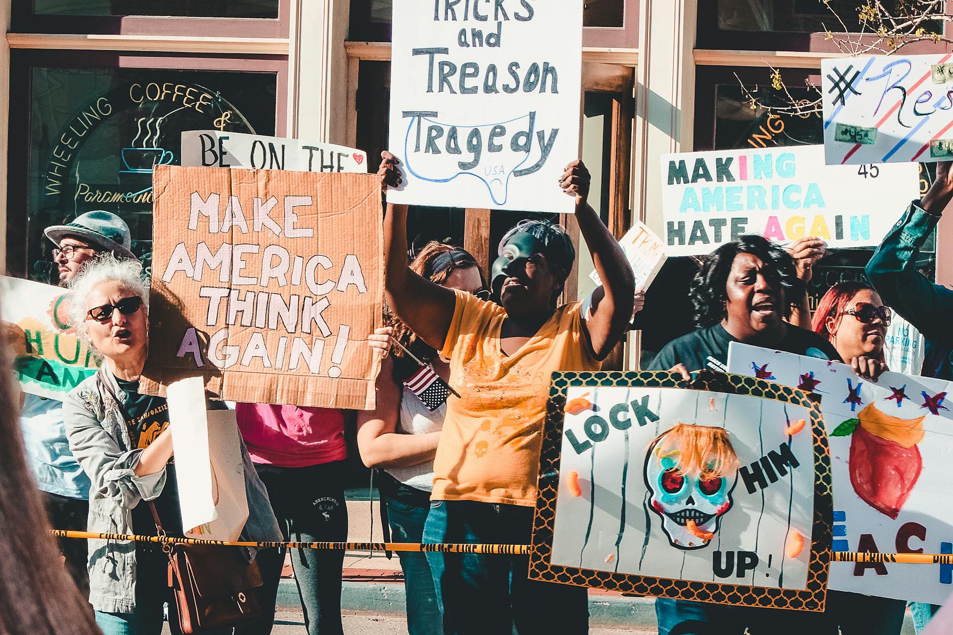 people rallying in front of coffee shop