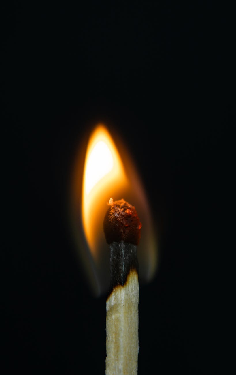 close up shot of a burning match stick